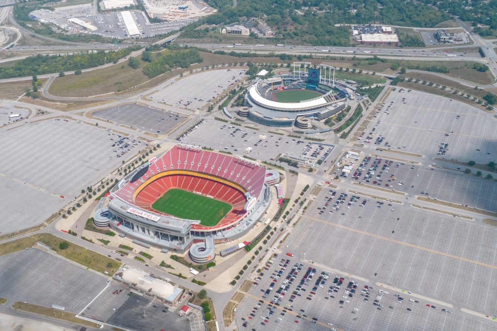 The USA, Kansas City, September 2022: Aerial view of the GEHA Field at Arrowhead Stadium and Aramark-Kauffman Stadium. The World Cup of soccer FIFA will be take in the USA, Canada and Mexico. xkwx america, architecture, arena, ball, center, champion, championship, clouds, cup, field, fifa, foot, football, game, goal, grass, green, ground, kansas city, kick, match, missouri, national, new, north america, open, orange, parking lot, play, player, playground, professional, sky, soccer, soccer field, sport, stadium, super, superbowl, team, tennis, tournament, travel, tribune, usa, world, world cup, drone, Chiefs